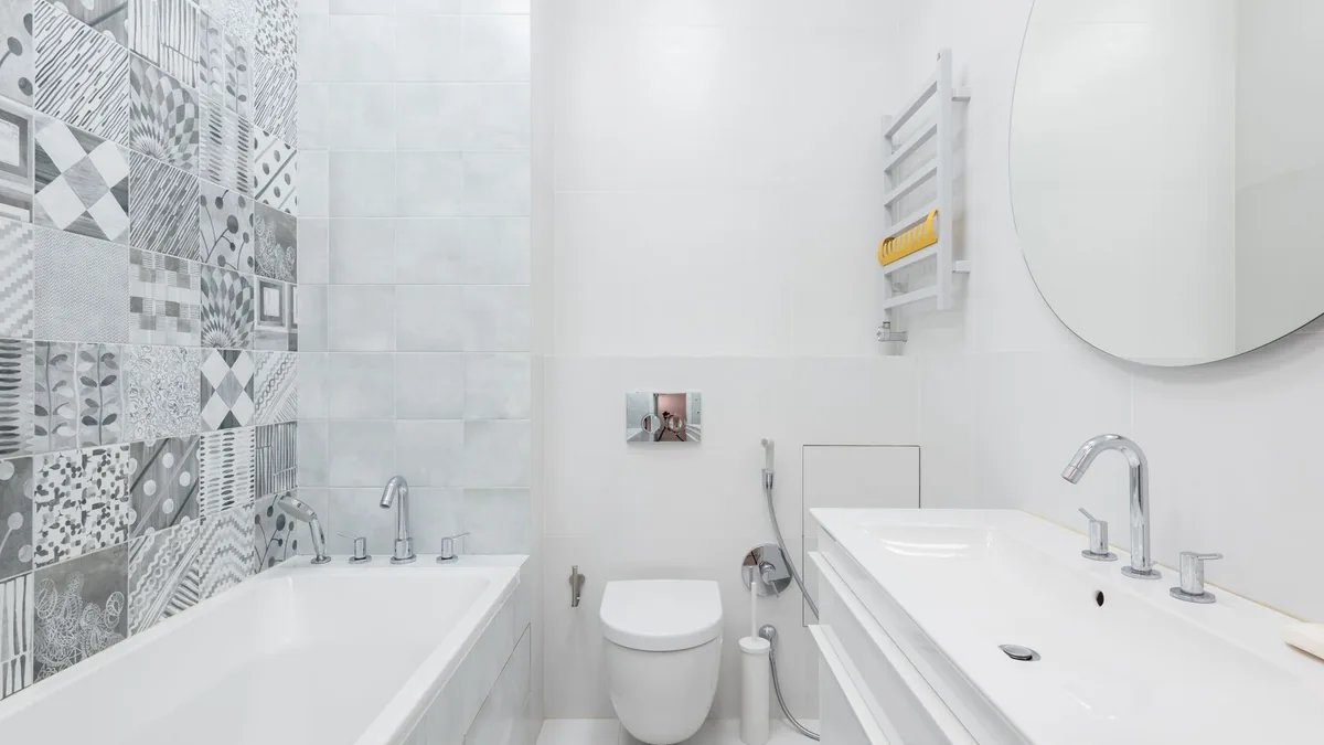 Remodeled bathroom with new tile, tub, and vanity in a St. Paul, MN home