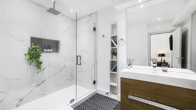 Contractor setting shower wall tile in St. Paul, MN