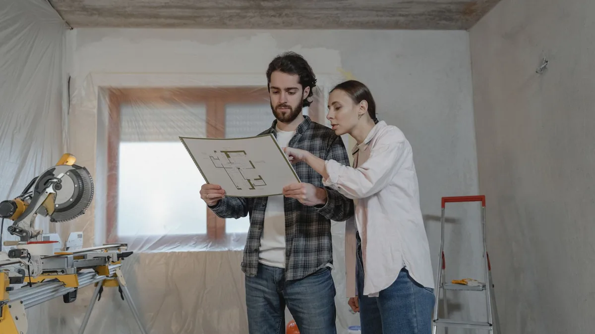 Contractor reviewing bathroom remodel plans with a St. Paul, MN homeowner